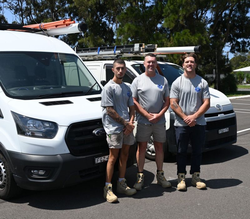 The IllaVolt Electrical team of licensed electricians with their service vans in the Illawarra